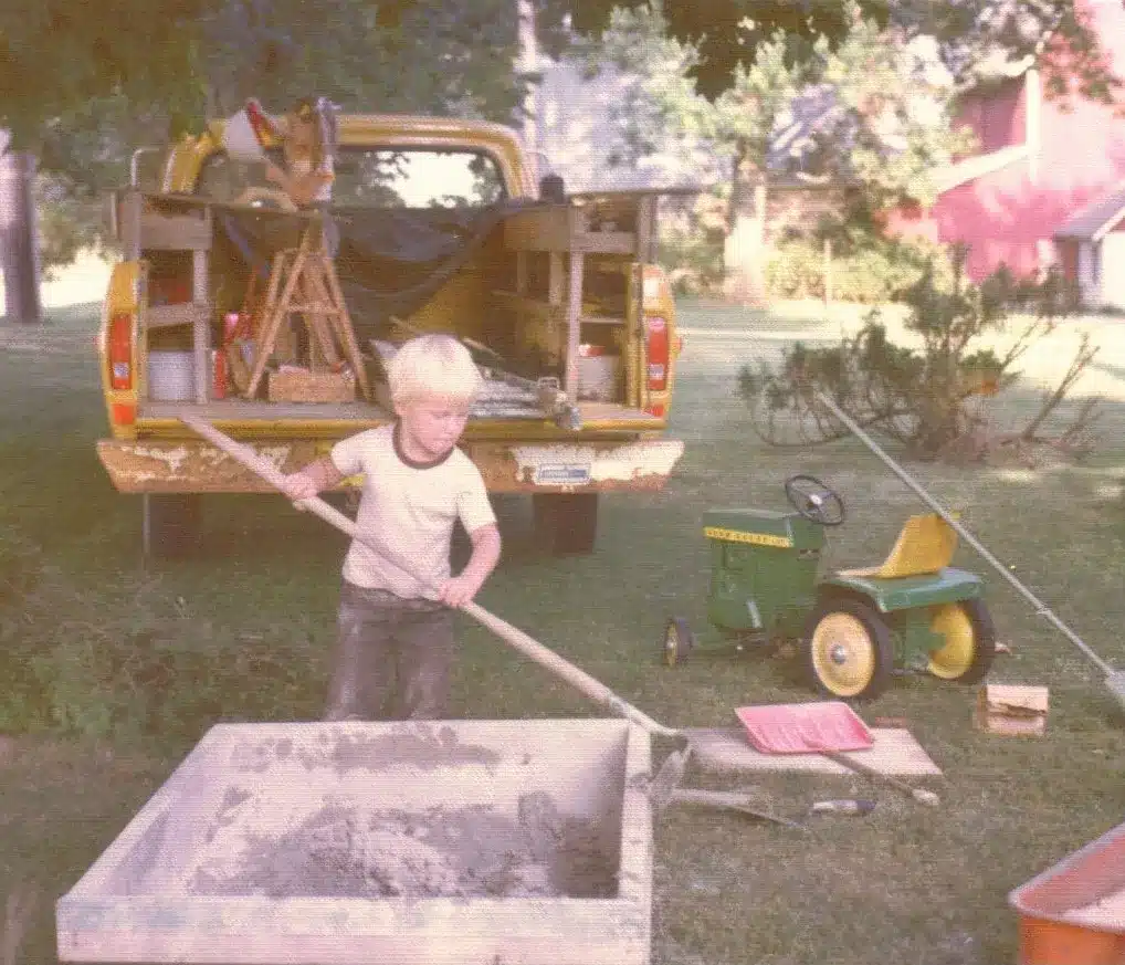 Young Tom Holtz digging in the dirt