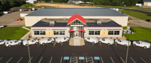 Holtz Builders Building with HBI Trucks parked in front
