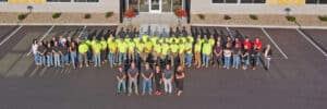 Employee Picture in front of Main headquarters in WI Dells
